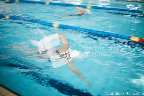 Image of Sports, water splash or women in swimming pool for a race competition, exercise or cardio workout. Fast swimmers, freestyle stroke or healthy girl athletes racing with fitness speed or motivation