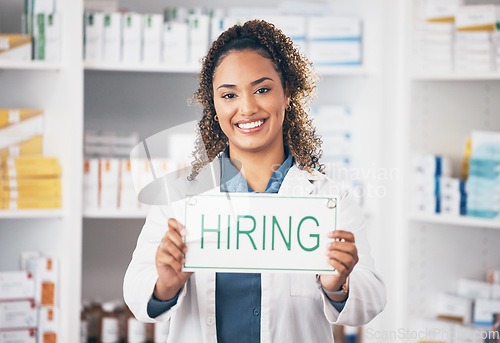 Image of Pharmacist woman, smile and poster in portrait for hiring, job and opportunity in healthcare store. Pharmacy, small business owner and paper for recruitment, onboarding and announcement for medicine