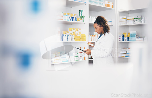 Image of Tablet, stock and medicine with a woman in a pharmacy to fill an online order of prescription treatment. Medical, product or insurance with a female pharmacist working as a professional in healthcare