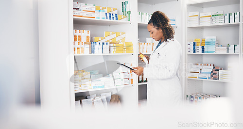 Image of Tablet, stock and insurance with a woman in a pharmacy to fill an online order of prescription treatment. Medical, product and healthcare with a female pharmacist working as a medicine professional