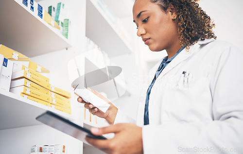 Image of Tablet, stock and medicine with a pharmacist woman at work to fill an online order or prescription. Medical, product and insurance with a female working as a professional in healthcare at a pharmacy
