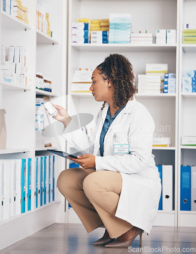 Image of Tablet, stock and insurance with a pharmacist woman at work to fill an online order or prescription. Medical, product and healthcare with a female working as a medicine professional in a pharmacy