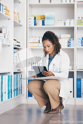 Image of Pharmacy, focus and pharmacist woman on tablet for medicine management, stock research or inventory. Digital, product logistics and retail or medical doctor, checklist and pharmaceutical folder check