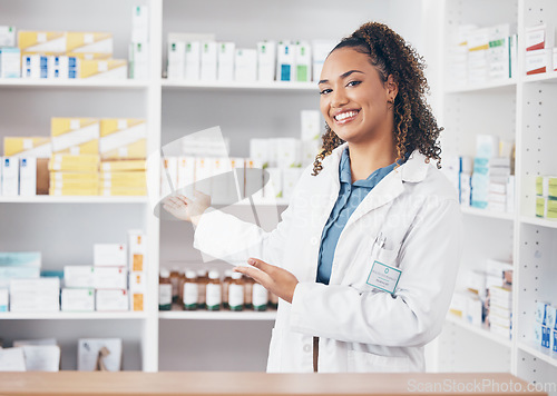 Image of Pharmacist woman, portrait and counter help, choice or show medicine stock, product and happy customer service. Biracial doctor, medical professional and pharmacy, healthcare advice of drugs on shelf