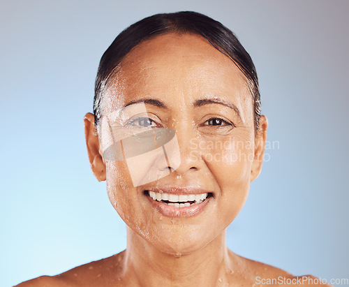 Image of Old woman, water on face and smile with beauty in portrait, antiaging skincare and natural cosmetics on studio background. Headshot, facial and clean skin, happy female with cosmetic care and hygiene