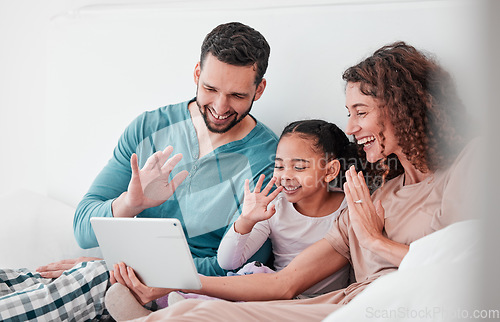 Image of Love, video call or family in bed, smile or talking online with tablet, bonding and interracial. Parents, mother and father with daughter, girl and female child in bedroom, device or greeting in home