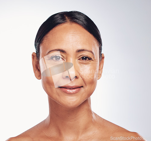 Image of Happy, skincare and portrait of a mature woman isolated on a white background in a studio. Anti aging, beauty and the face of a model with a smile for dermatology, skin glow and care in retirement