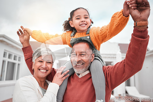 Image of Happy, smile and portrait of grandparents and child for bonding, playful and affectionate. Weekend, free time an happiness with family on lawn at home for support, care and holiday together