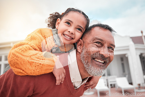 Image of Smile, piggy back and grandfather with child in yard of house, happiness and security at family home. Relax, happy old man and girl bonding in backyard together with love and outdoor fun on weekend.