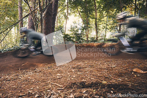 Image of Fitness, cycling, and fast with people in nature for training, extreme sports and motion blur. Workout, race and speed with cyclist on bike in forest park for performance, challenge and adventure