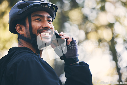 Image of Man, cycling and phone call outdoor in nature for sports, exercise or training on a mountain bike. Athlete male person on a smartphone for communication with contact for a fitness workout in a forest