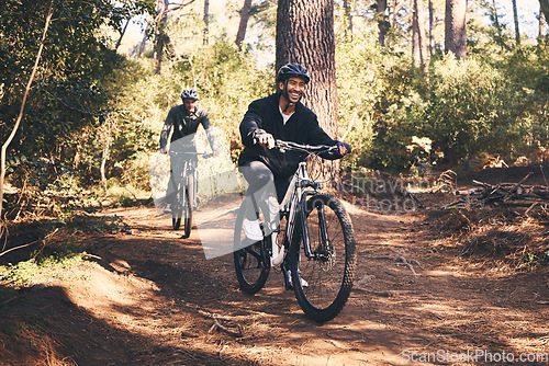 Image of Forest, fitness and friends cyclist on bicycle in nature with helmet, exercise adventure trail and health mindset. Cycling, woods and man with mountain bike in trees for workout, motivation or energy