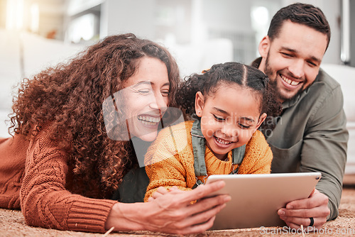 Image of Happy family on floor with tablet, kid and movies, streaming service for child development video for education. Mom, dad and girl on carpet, happiness and smile, digital entertainment in living room.