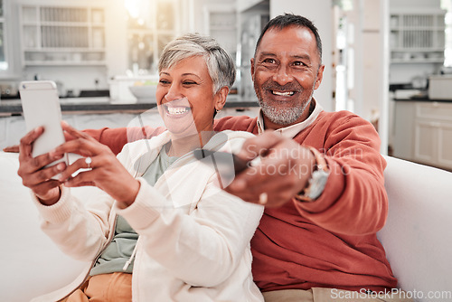 Image of Watching tv, phone and happy couple in home living room, bonding and having fun. Cellphone, television and elderly man and woman enjoying retirement, smile and streaming movie, video or film on sofa.