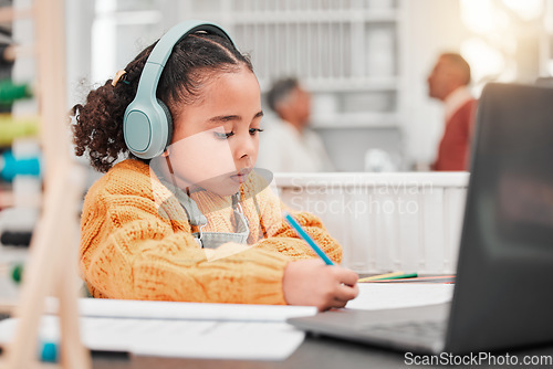 Image of Headphones, elearning and kid writing in home for online class, homeschool and homework. Laptop, education and development of girl studying, distance learning and knowledge, notes and growth in house