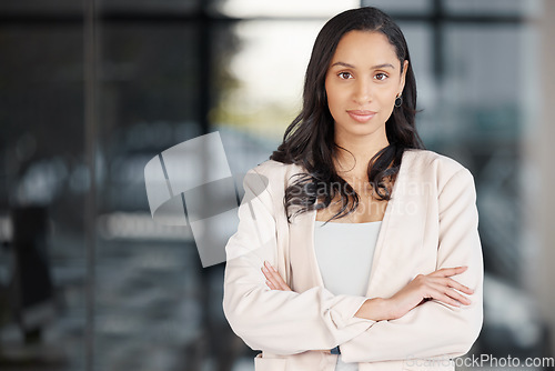 Image of Business woman, portrait smile and arms crossed in confidence for management or career ambition at office. Confident, proud and happy female manager, professional or corporate executive smiling