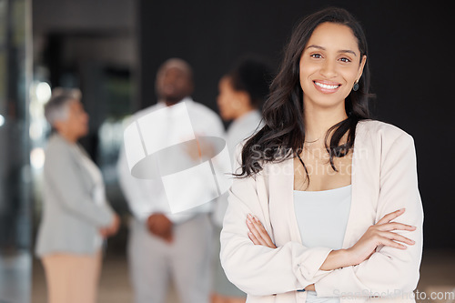 Image of Business woman, portrait smile and leadership for meeting, planning or teamwork collaboration at the office. Happy and confident female leader or manager smiling with arms crossed for team management