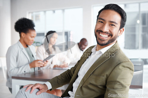 Image of Portrait, meeting and a business man in the boardroom with a positive mindset for planning or strategy. Corporate, professional and vision with a young male employee sitting in his work office