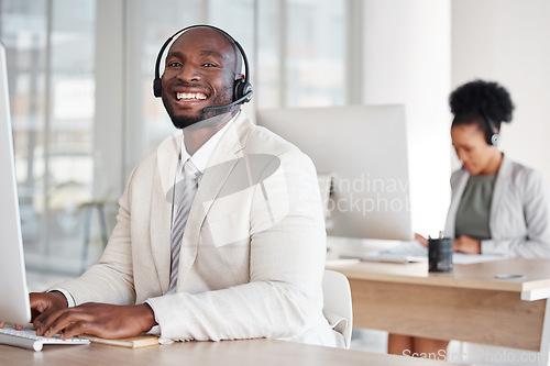 Image of Portrait, call center and black man consulting for crm, telemarketing and customer service with a smile. Happy, face and male consultant in office for online help, support and faq or contact us