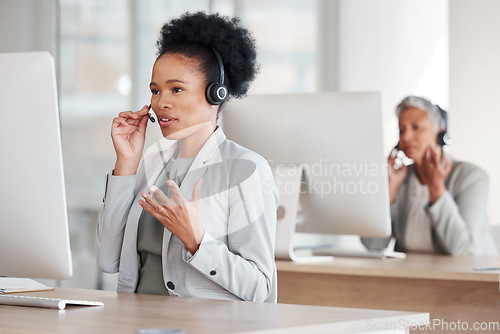Image of Callcenter consultant, black woman and CRM, phone call and talking, communication and contact us. Conversation, telecom and female, customer support or telemarketing with agent and help desk employee