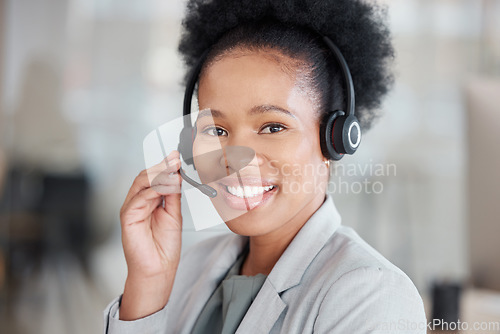 Image of Callcenter consultant, black woman and CRM, smile in portrait with phone call, communication and contact us. Happy female, telecom with customer support or telemarketing, agent and help desk employee