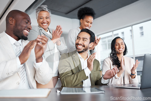 Image of Business people, laptop and clapping hands in meeting for proposal, logo or reveal in office. Team, applause and corporate success by group celebrating achievement, project and job well done together