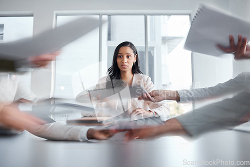 Image of Business woman, anxiety and stress in a meeting or busy office with documents or paperwork. Professional female manager at table with team hands for stress, depression or burnout for deadline crisis