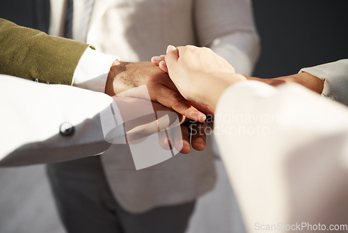 Image of Business people, hands together and solidarity in team, collaboration and motivation in office. Support, employees in meeting and corporate group with teamwork, professional community and workforce