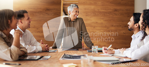 Image of Senior woman, laughing or business people in meeting speaking, planning or sharing funny joke together. Group collaboration, diversity or happy designers with manager talking about ideas or strategy