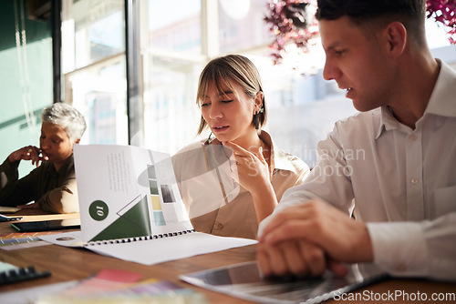 Image of Documents, woman or businessman in meeting reading a portfolio for project planning together in office. Team collaboration, paperwork or focused people thinking about design ideas or group strategy