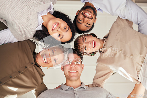 Image of Meeting, portrait or happy business people in huddle with goals, support or motivation for success. Low angle of faces, team work or employees planning our vision, sales target or mission