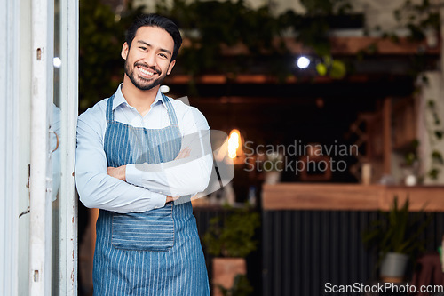 Image of Happy asian man, portrait and arms crossed in small business at restaurant for welcome, service or job at door. Male entrepreneur smile in confidence at entrance ready to serve in coffee shop or cafe