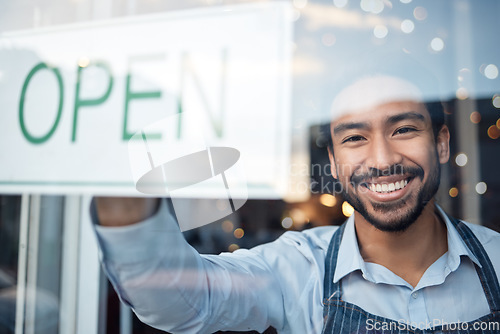 Image of Asian man, small business and portrait smile with open sign on window for service in coffee shop or restaurant. Male entrepreneur or manager with billboard or poster for opening retail store or cafe