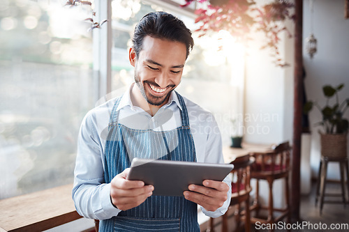 Image of Restaurant, tablet and happy man or small business owner, e commerce and online cafe or coffee shop management. Waiter or asian person reading sales on digital technology or internet for his startup