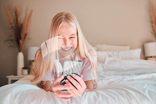 Image of Relax, smile or woman on bed, smartphone or typing for social media, connection or break. Female, girl or person with cellphone, mobile app or communication with network signal or chatting in bedroom