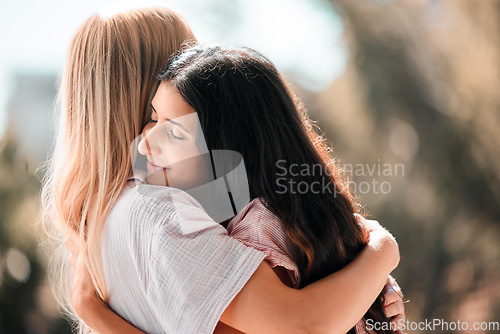 Image of Woman friends, hug and reunion outdoor in park, garden or backyard with love, care and bonding in summer. Women, embrace and happiness for meeting, welcome and support in sunshine for solidarity