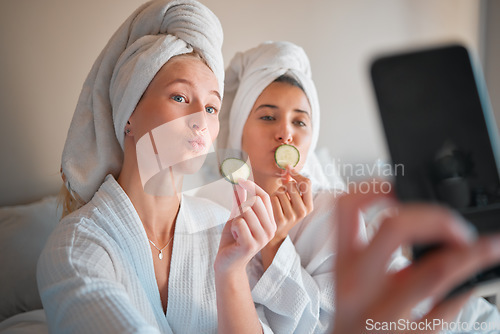 Image of Woman, friends and selfie in beauty spa for social media, vlog or profile picture with cucumber in skincare treatment at resort. Happy women posing for photo in natural zen or body care at salon