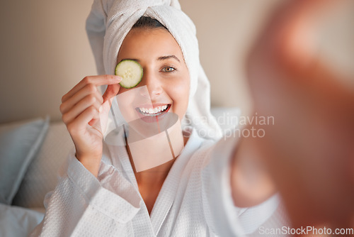 Image of Woman, spa and selfie with cucumber on eye in comic portrait for wellness, self care and relax. Girl, fruit and face for skincare, health and smile for cosmetics, beauty and natural glow in morning