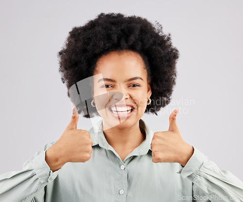 Image of Thumbs up, hands and portrait of happy woman in studio, excited winner and bonus on white background. Female model, thumb and smile to celebrate winning achievement, like emoji and feedback support