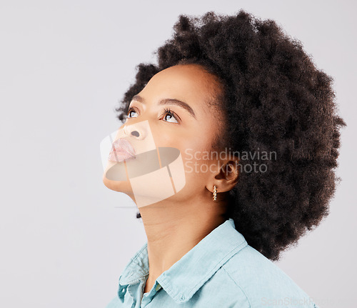 Image of Black woman, afro and thinking in studio with vision, ideas or looking up by white background. Girl, young model and student with idea, brainstorming or mindset for focus, fashion or calm by backdrop