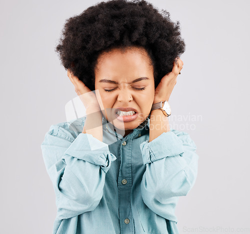 Image of Blocking ears, headache and woman face with stress and burnout feeling frustrated. Mental health, stressed and anger problem from female with anxiety and pain in isolated studio with grey background