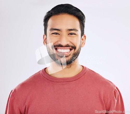 Image of Happy, handsome and a headshot portrait of an Asian man isolated on a white background in studio. Smile, pride and a guy with confidence, happiness and attractive while smiling on a backdrop