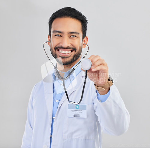 Image of Doctor, man and listen with stethoscope in portrait with smile and cardiovascular health isolated on white background. Medical professional, happy male physician in studio and cardiology and surgeon