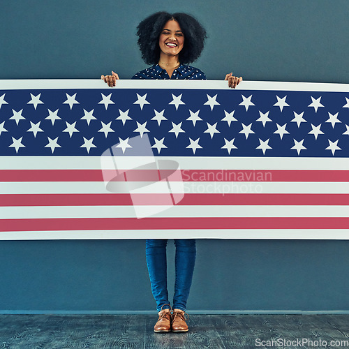 Image of Portrait, American flag and woman with smile, patriotic and pride for country against a wall. Face, female and person with USA symbol, confidence and motivation for freedom, human rights or happiness