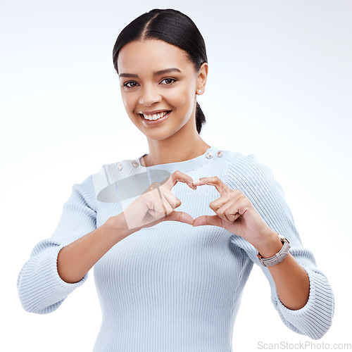 Image of Face portrait, studio and happy woman with heart hand sign for romantic love, care and support. Valentines day, happiness and isolated person with emoji icon gesture for kindness on white background