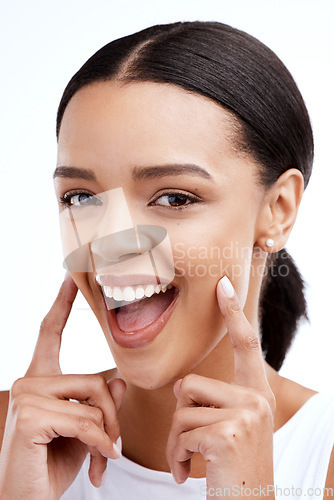 Image of Happy, gesture and portrait of a woman for beauty isolated on a white background in a studio. Smile, skincare and face of a young model looking confident about clear complexion and smooth skin