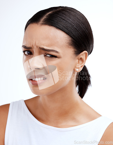 Image of Confused, portrait and woman in studio with attitude, annoyed and unsure against white background. Wtf, face and frustrated girl with doubt, contemplating and thinking emoji, pensive and offended