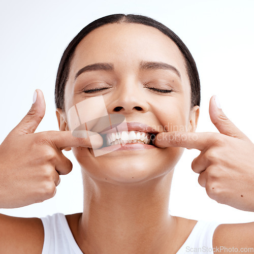 Image of Dental, woman and mouth care in studio for teeth whitening, hygiene and treatment on white background. Oral, cleaning and girl happy with invisible braces, veneers and tooth implants procedure