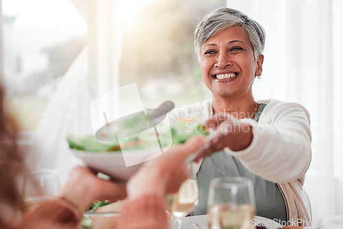 Image of Family dinner, senior woman and healthy salad of a happy female with food in a home. Celebration, together and people with unity from eating at table with happiness and a smile in a house giving meal