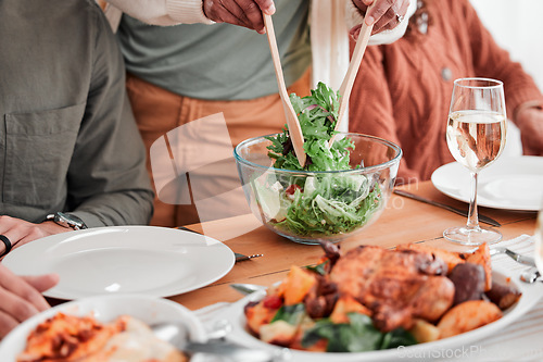 Image of Lunch table, family and dishing food, eating dinner or celebrating together. Salad, hungry and people dining with gourmet dishes, enjoying homemade cooking and sharing cuisine during supper at home